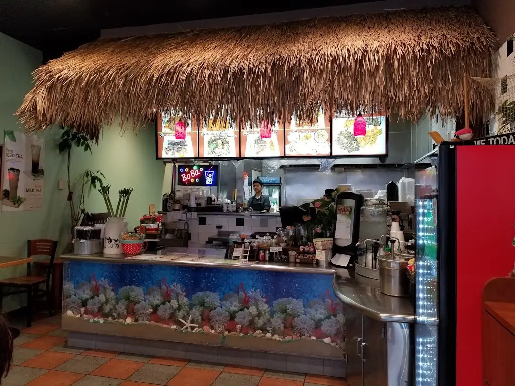 TK-Cafe-Hawaiian-BBQ-&-Dim-Sum-Hawaiian-restaurant-Cozy - dining - area-Monrovia A cozy dining space with thatched roof and sea - themed counter at TK Cafe Hawaiian BBQ & Dim Sum, a Hawaiian restaurant in Monrovia